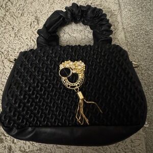 Elegant Black Handbag with Gold Accent